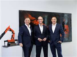 three men in suits from Palfinger: Hubert Palfinger, Alexander Susanek, Hannes Palfinger