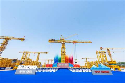 yellow tower cranes erected and on display in yard